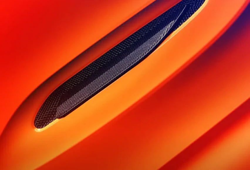 Upclose view of orange Aston Martin DBX707 headlight