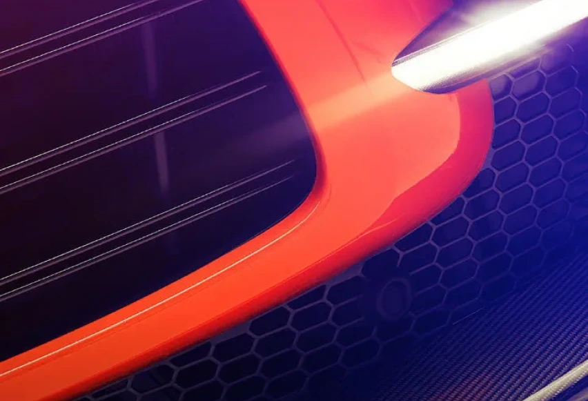 Front view of grill of orange Aston Martin DBX707