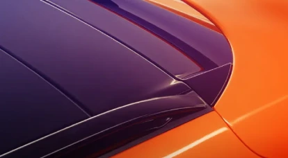 Upclose view of back of orange Aston Martin DBX707