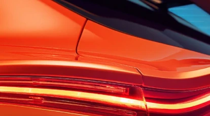 Upclose view of back tail light on orange Aston Martin DBX707